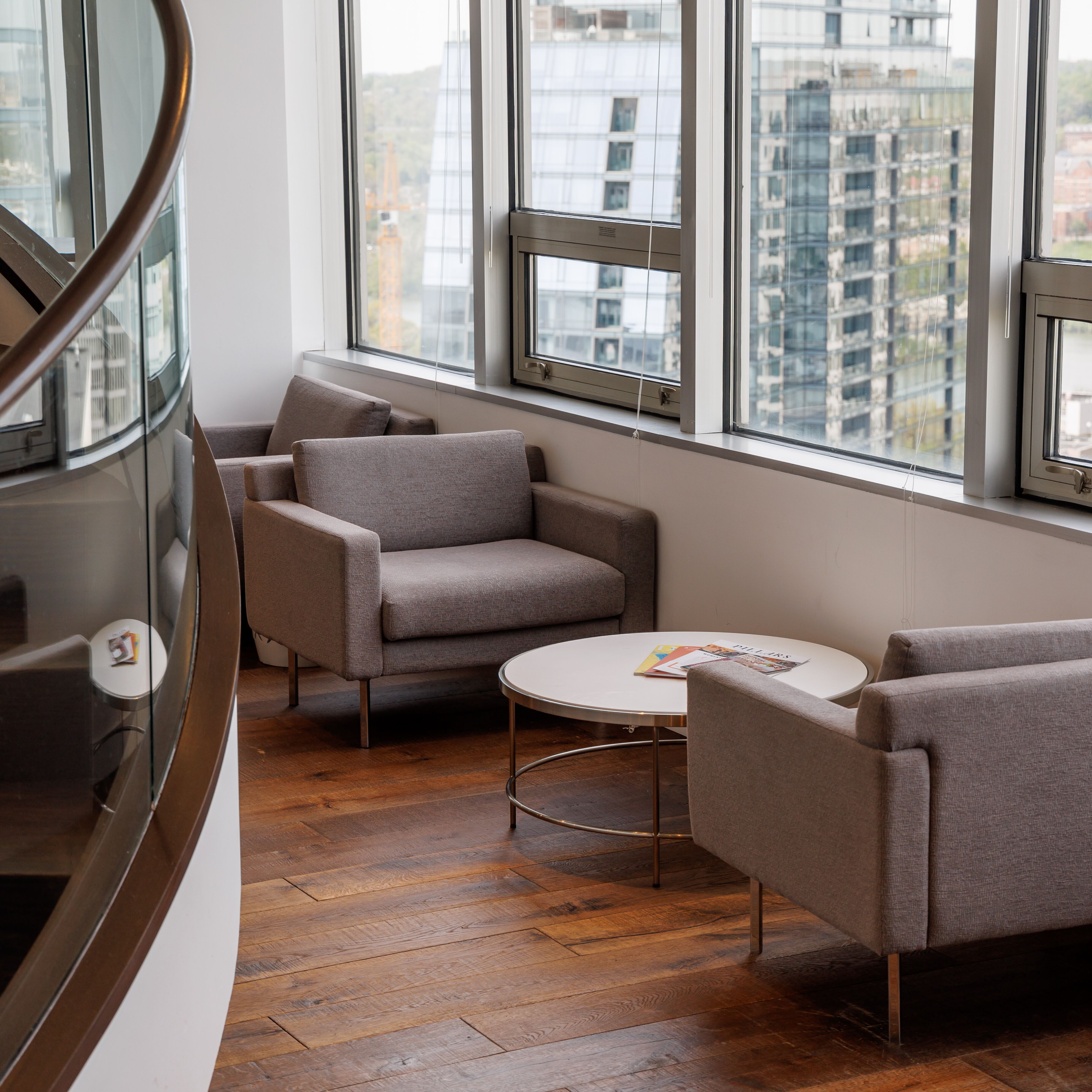 Two seats across from each other with a round table